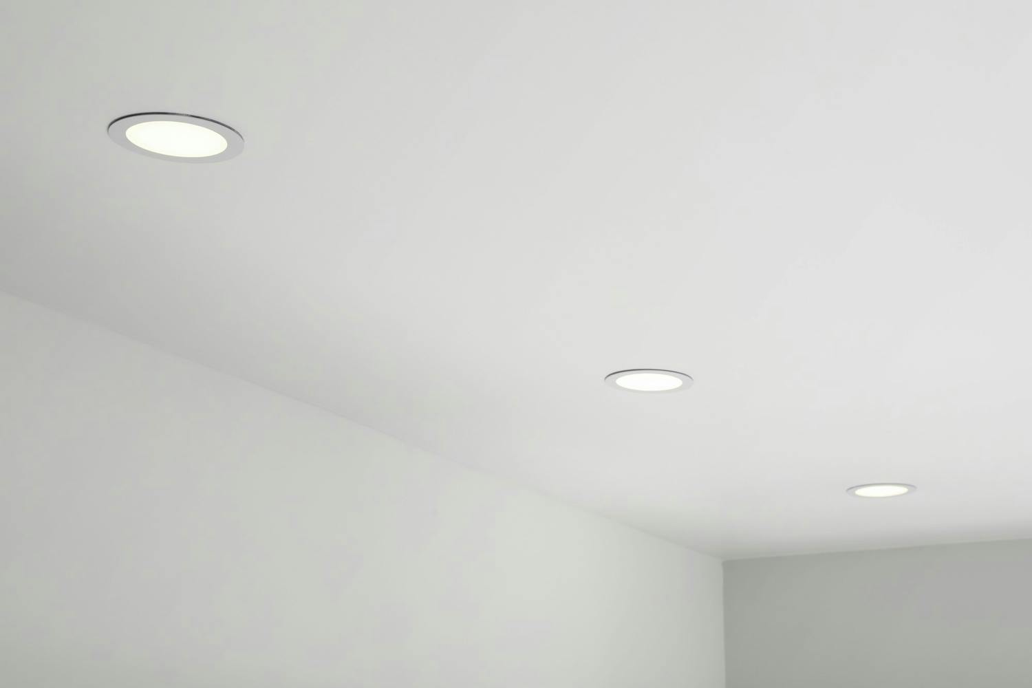 White ceiling with modern lighting in room, low angle view